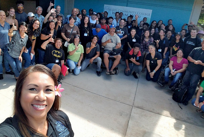 large group of people in front of Waianae Moku sign
