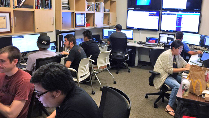 students working on computers in one room
