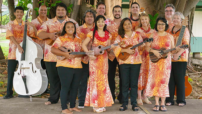 Group of people in aloha wear with instruments