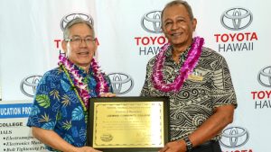 Ching and Cabral holding a plaque