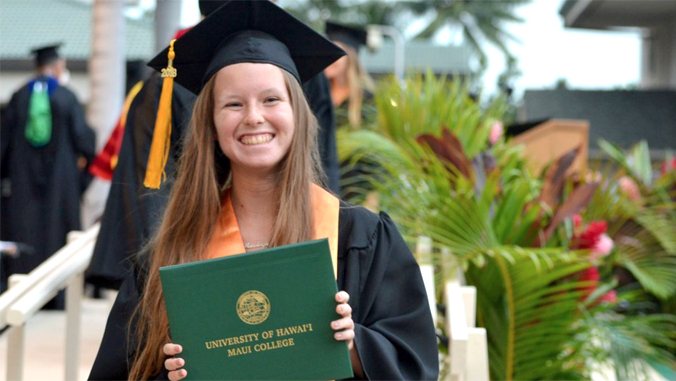 Hendricks holding her diploma