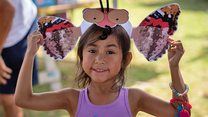 girl wearing butterfly hat