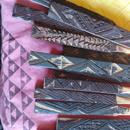 Traditional Hawaiian kīhei adorn UH Mānoa graduates