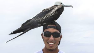 Student with a bird on his head