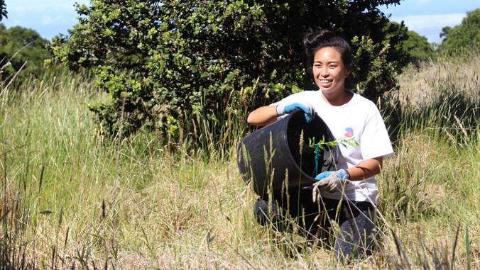 student planting trees