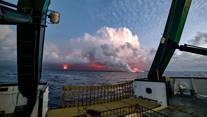 lava pouring into the ocean on Hawaii Island