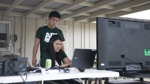 Two students working at a computer, click for larger image