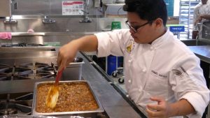 culinary student making stew