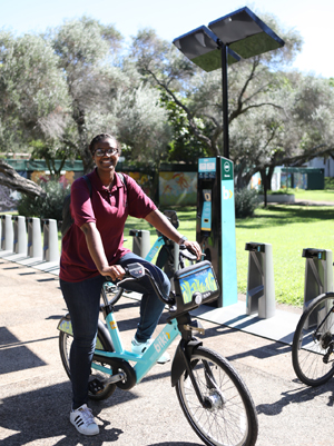 student on a Biki bicycle