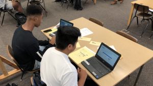 two students using computers