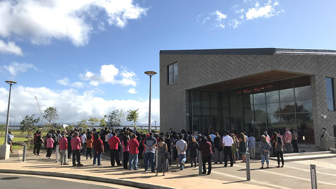 people standing in front of a building