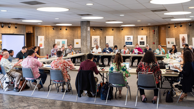 people sitting at tables during conference