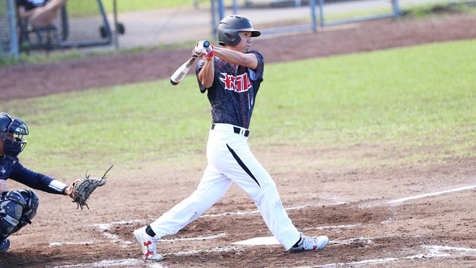 student swinging a baseball bat
