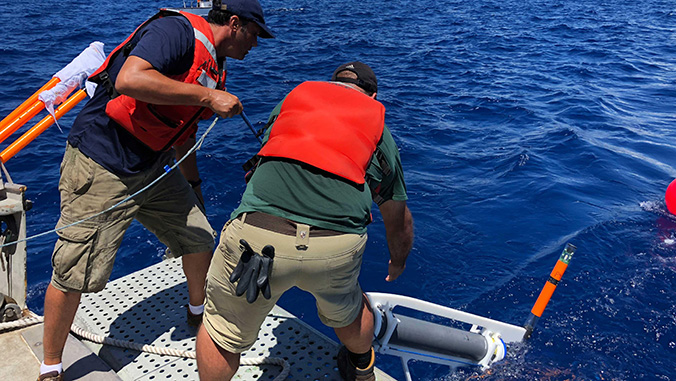 From left, Eric Attias and Jake Perez deploy the system