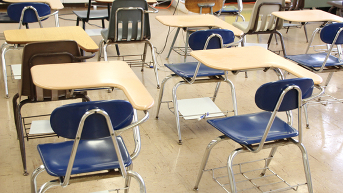 desks and chairs in empty classroom