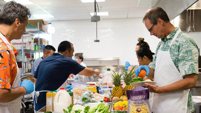 people making food in a kitchen