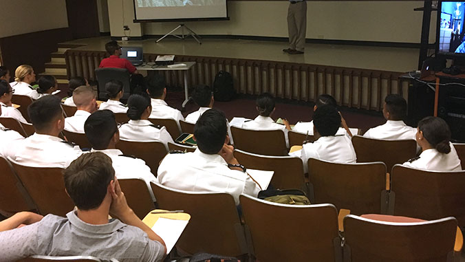 Senior ROTC cadets listen to a presentation.
