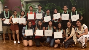 Students holding certificates