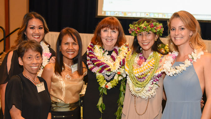 Group photo of Dean Mary Boland and staff