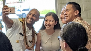 Adams taking selfie with several students