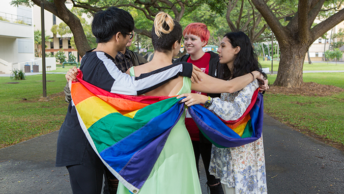 students with gay pride flag