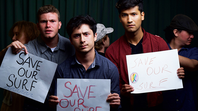 three men holding signs that say save our surf