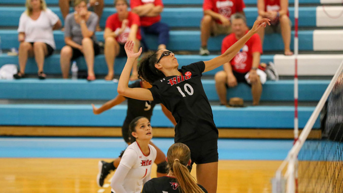 volleyball player setting up for a hit