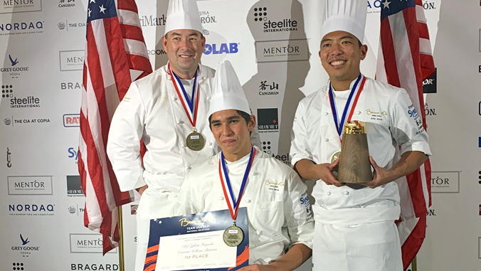 3 chefs wearing medals