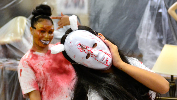 college students in halloween masks