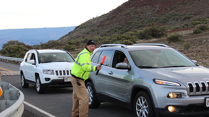 Ranger directing traffic on Maunakea