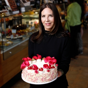 Karen Krasne holding cake