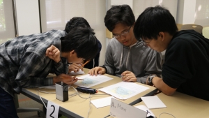 students working together at a desk