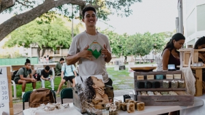 Student posing for a photo at UH Campus Center