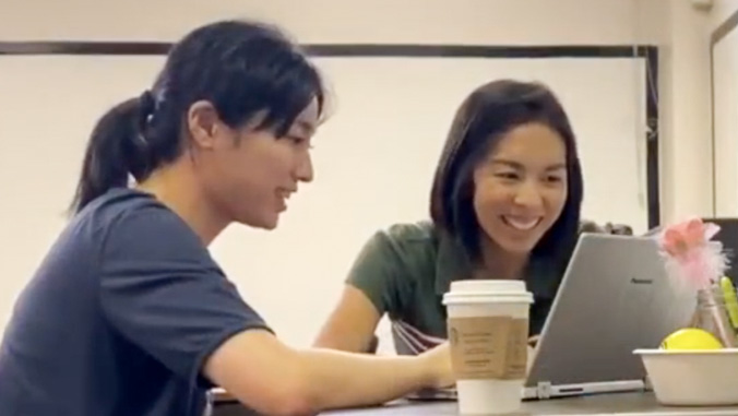 Two students at a laptop