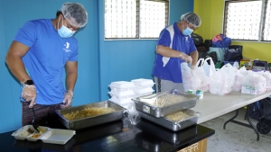 people packing food containers