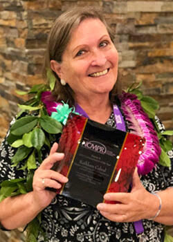 Kathleen Cabral with award