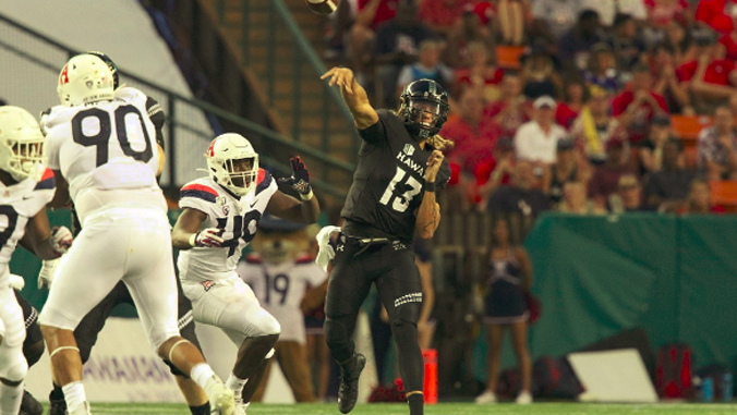 football player throwing a pass