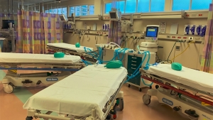 four hospital beds hooked up to one ventilator