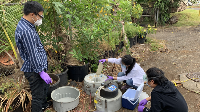 three people doing wastewater sampling research