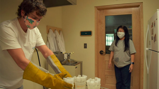 two employees work in the lab