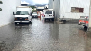 vehicles parked in flooded area