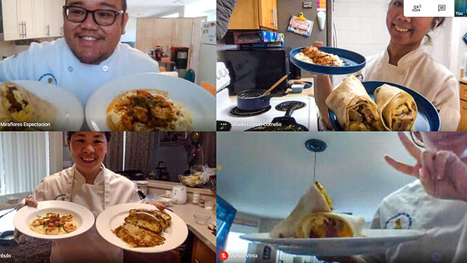 students showing their dishes
