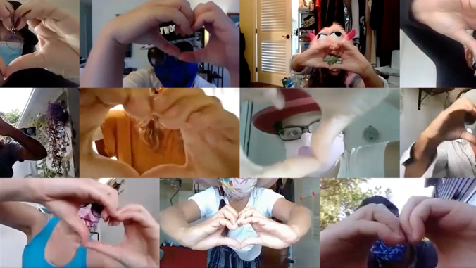 11 people make heart shapes with their hands
