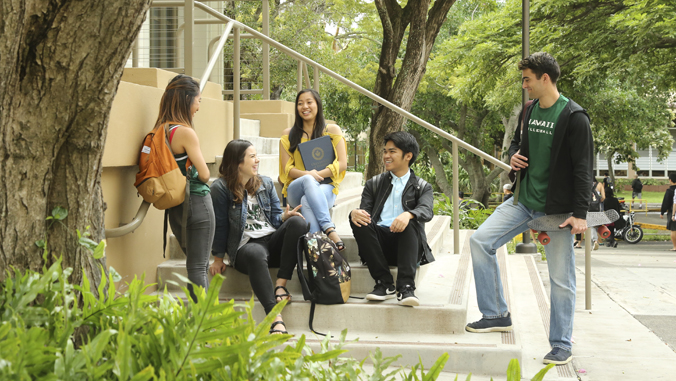 students sitting on steps