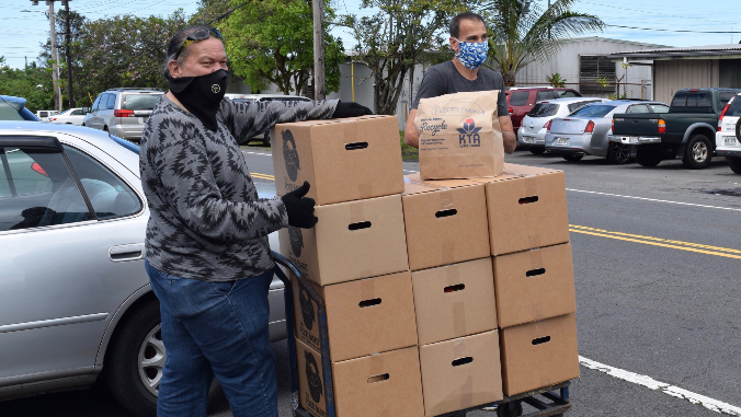 men with food boxes