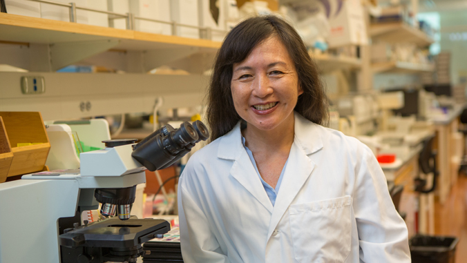 woman in lab coat in lab