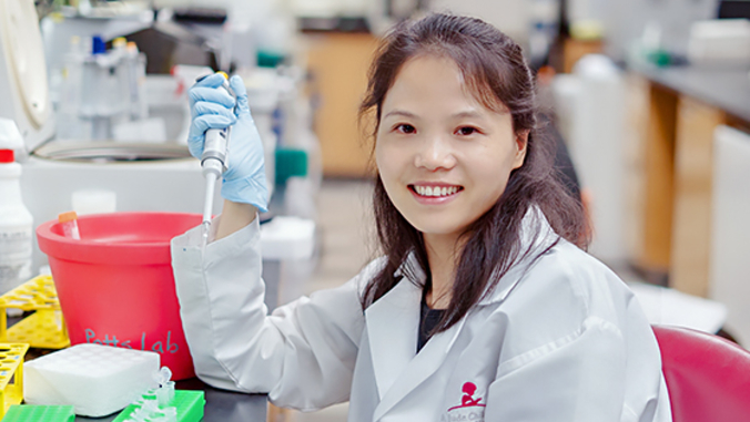 Yanghua He holding syringe