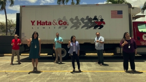 people standing in front of a truck