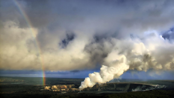 rainbow next to a volcano