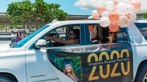 car with graduate banner